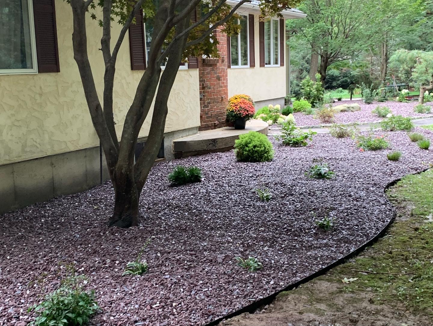 stones installed in flowerbed